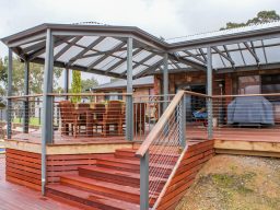 Raised timber verandah with metal balustrades