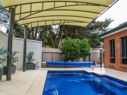 Vogue pergola protecting pool in South Australia